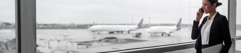 Woman talking on her phone in an airport