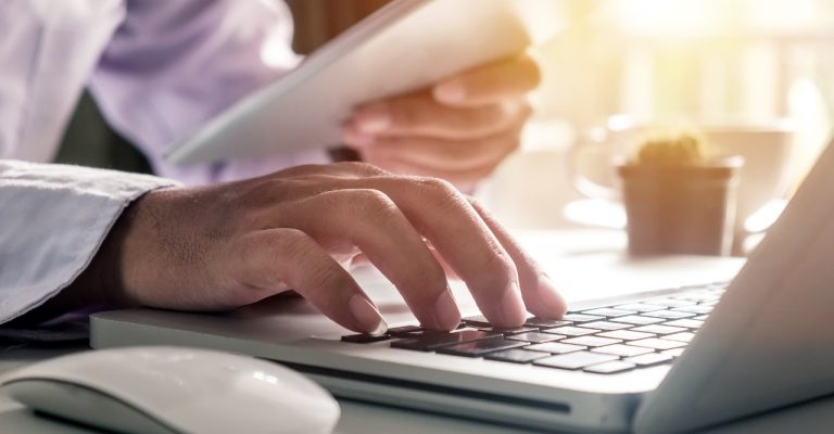 person typing on computer