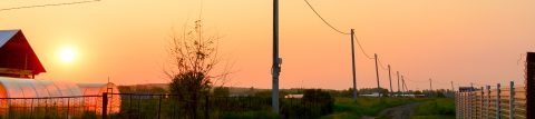 Farm with the sun setting