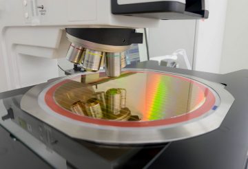 Image of a microscope inspecting a semiconductor wafer. 